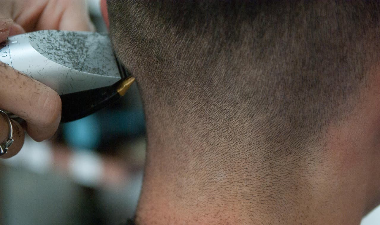 Clippers tidying the neckline on a short cut