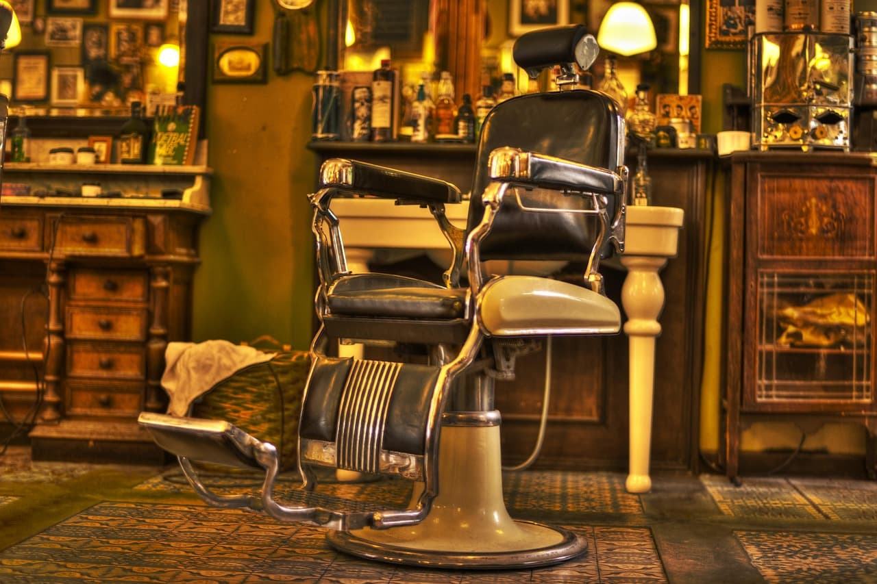 Vintage barber chair in a warm, wood-lined shop